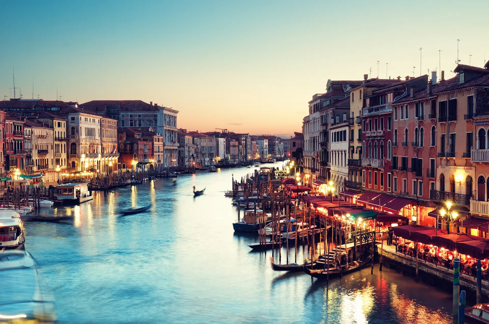 Gondolas and palazzos along the Grand Canal at dusk, Venice